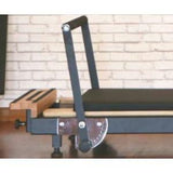 Close-up of Private Pilates Premium Foldable Metal Reformer showing metal frame and wooden details.