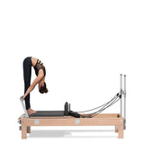 women stretching on basi pilates reformer