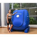 Woman beside Macy-Pan MC4000 Hyperbaric Oxygen Therapy Chamber in a bright room.