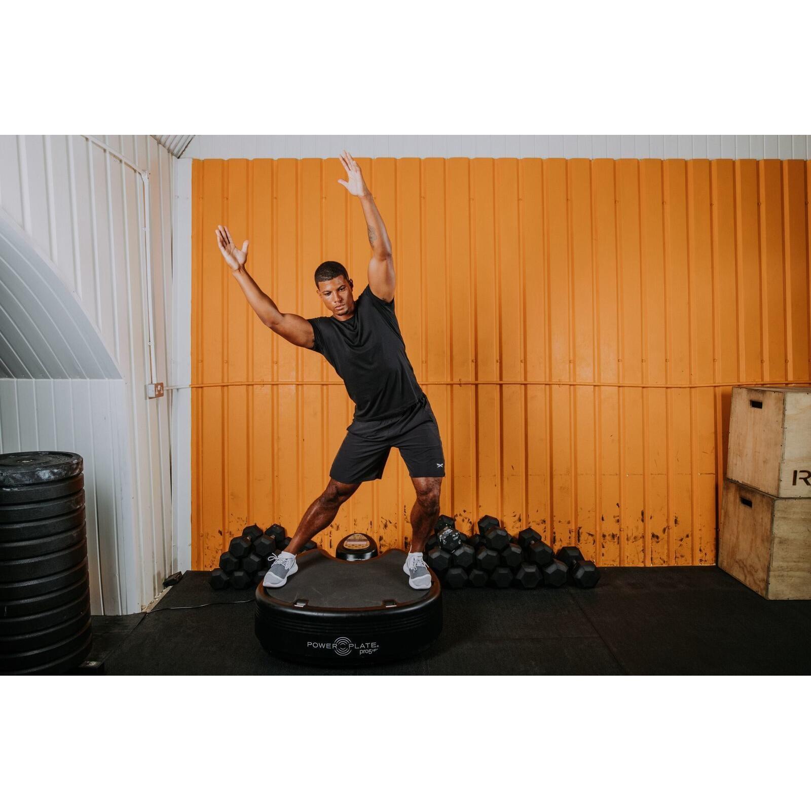 man streching on Power Plate pro5HP Full Body Vibration Platform