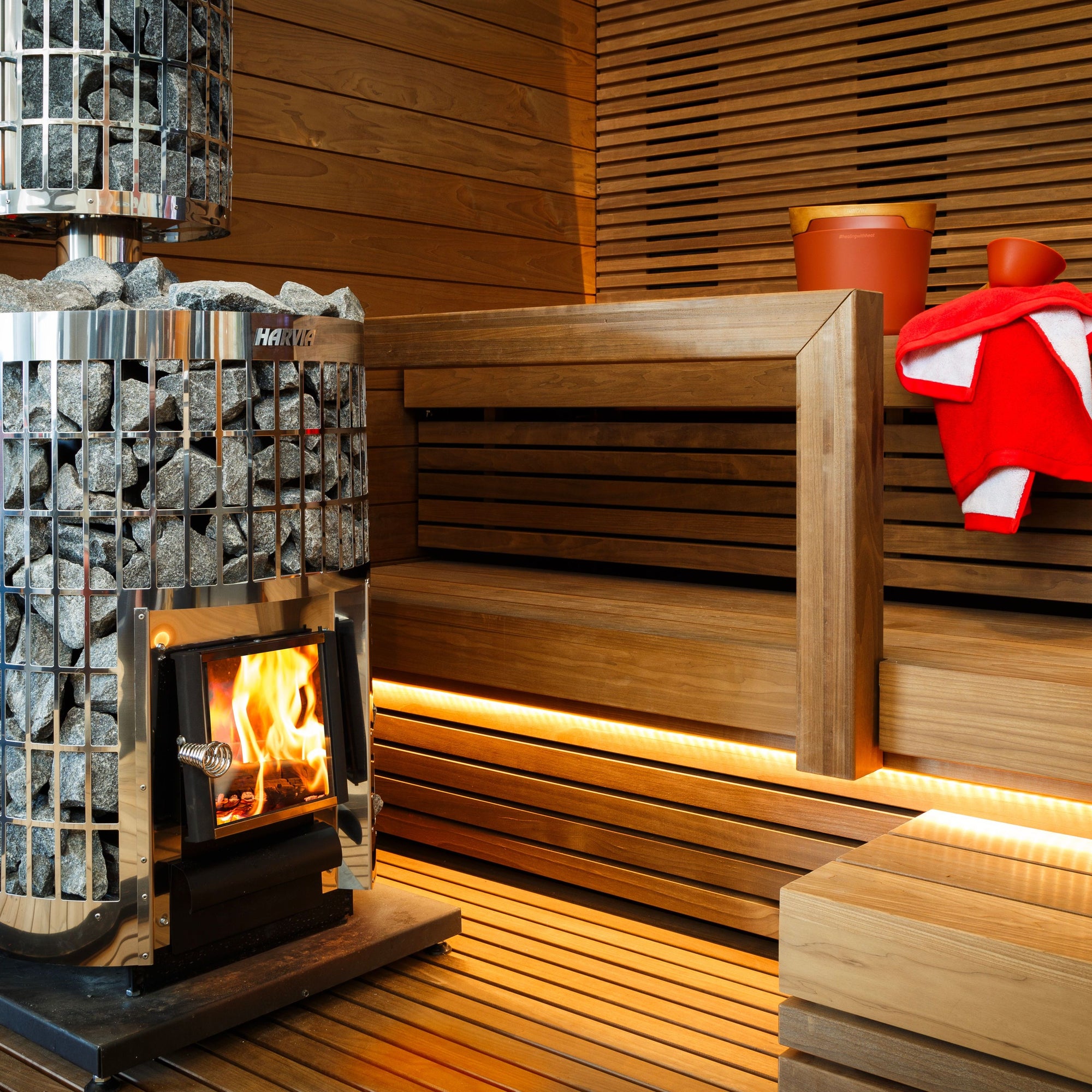 Harvia Cilindro wood burning sauna stove with stone-filled smoke pipe guard