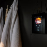 Harvia Fenix FX001XW WiFi control panel lit on a dark sauna wall