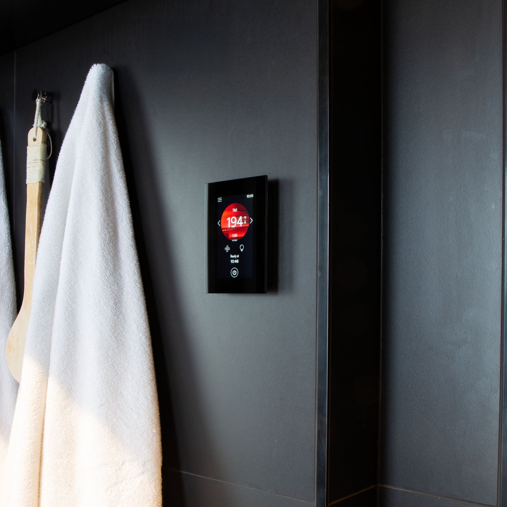 Harvia Fenix sauna control panel in a sauna changing room