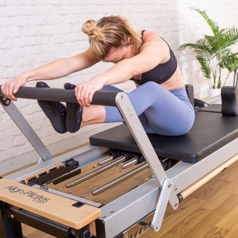 Diagonal studio view of the A8-Pro with a client mid exercise