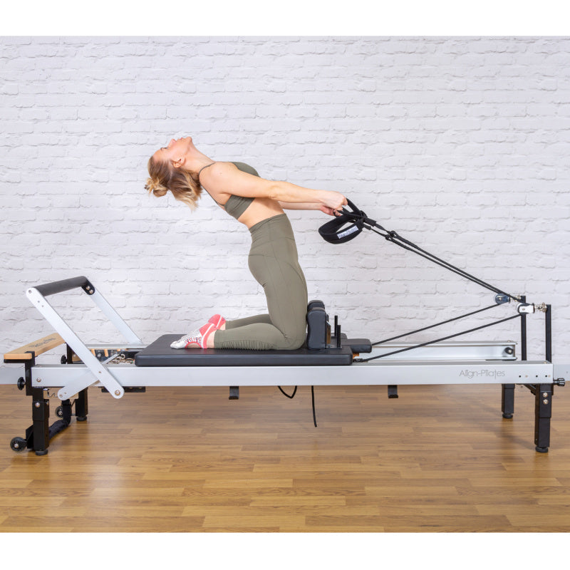 C8-Pro reformer side view with a client working on the carriage