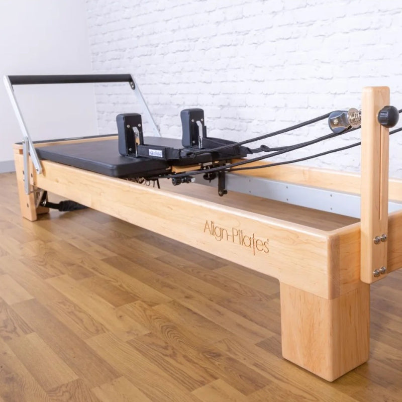 Align Pilates M8-Pro maple reformer with Half Cadillac, Half Cadillac uprights seen from the foot end