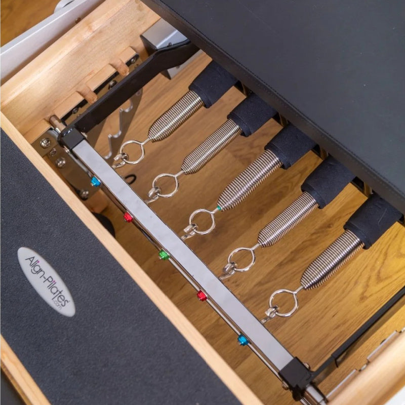 Align Pilates M8-Pro maple reformer with Half Cadillac, close up of the Rapid Change spring bar