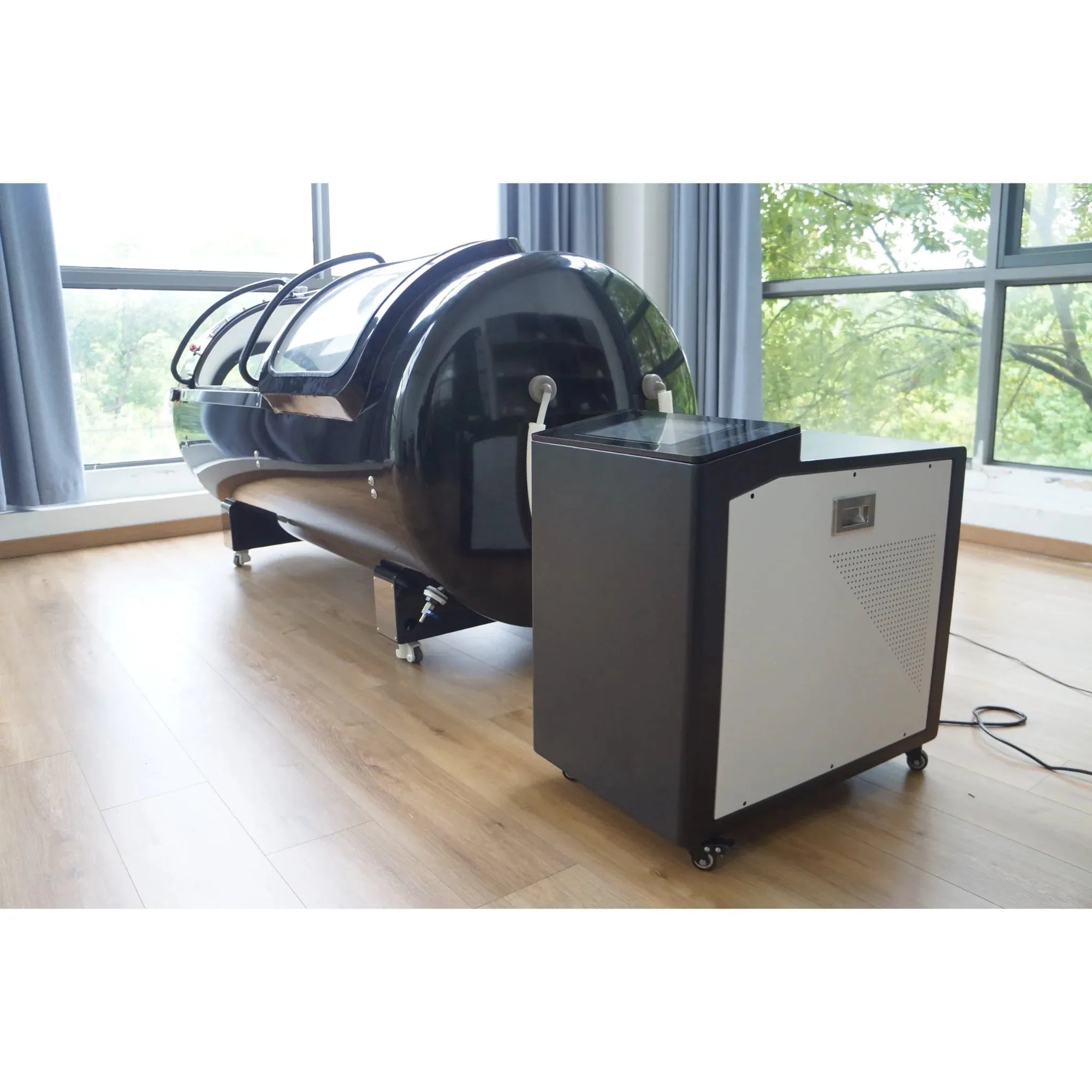 Macy-Pan HP2202-90 Diamond Hyperbaric Oxygen Therapy Chamber with control unit in bright room, used for recovery and wellness.