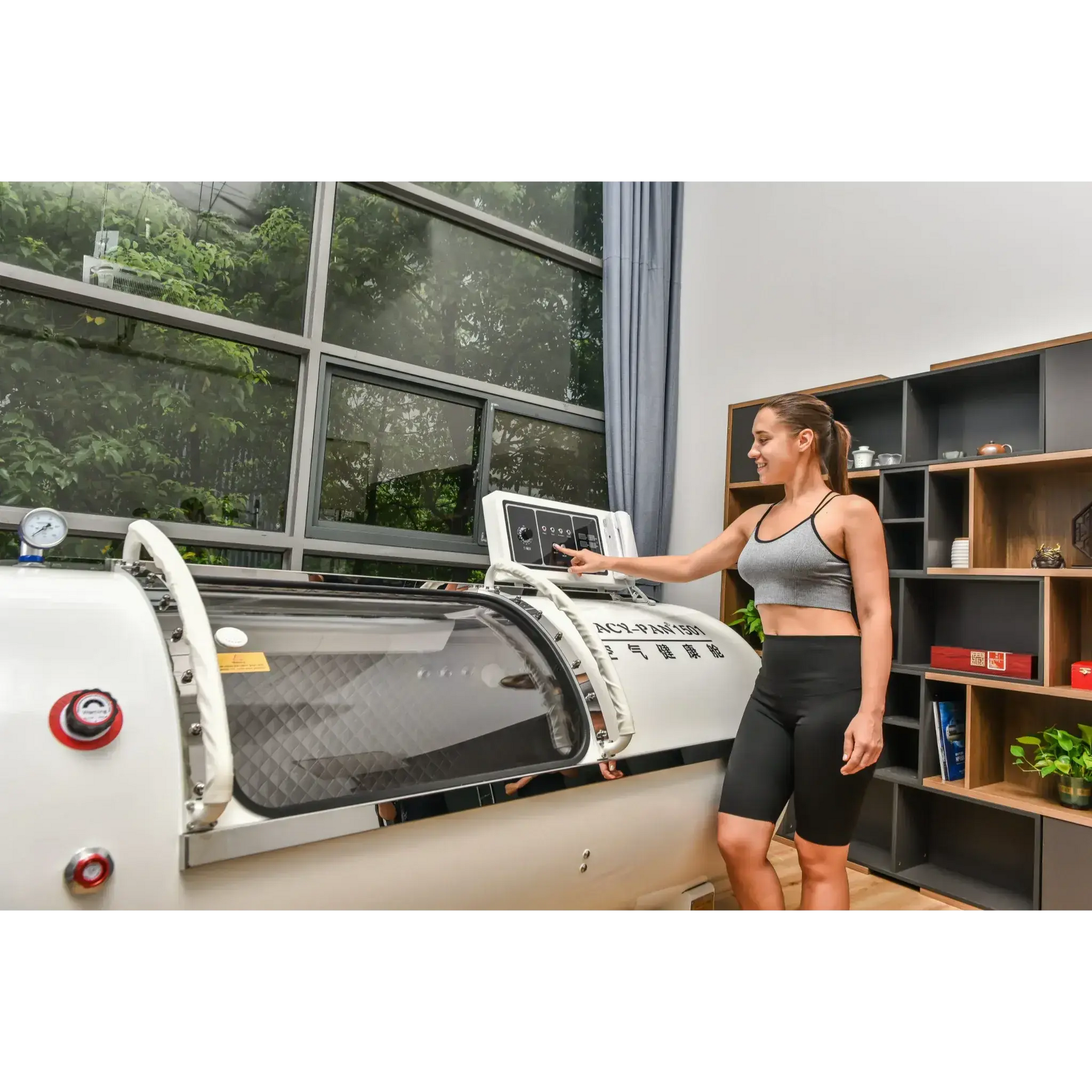 Woman using Macy-Pan HP1501 Hyperbaric Oxygen Therapy Chamber for enhanced recovery and well-being.