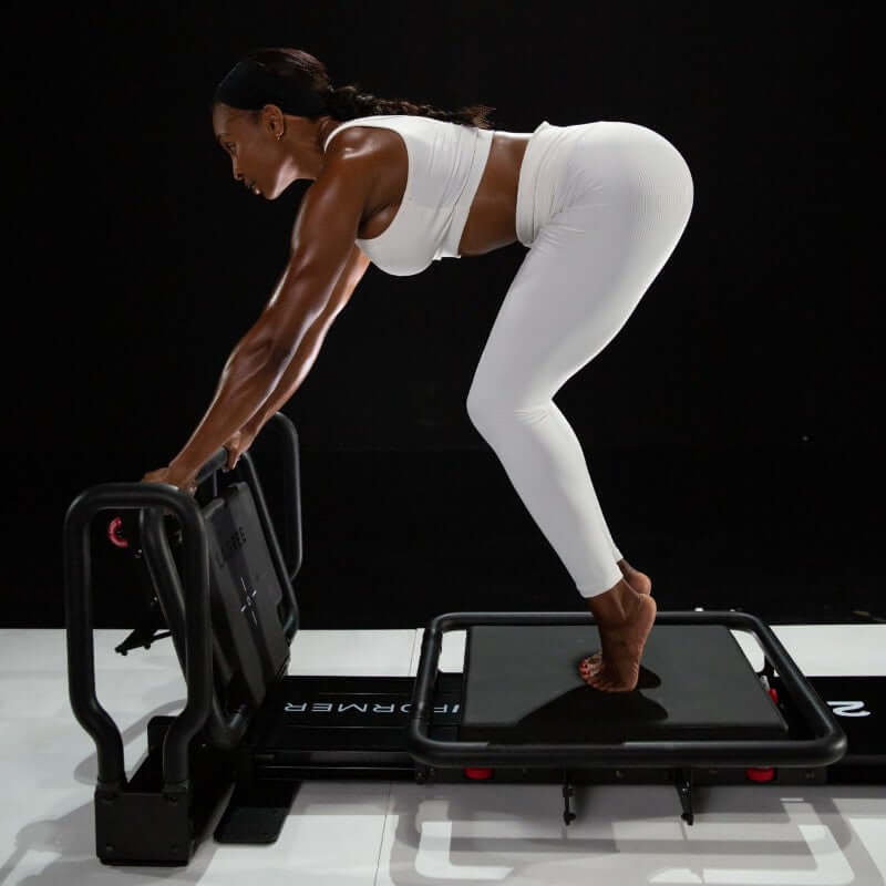 Lagree Fitness Miniformer exercises with platform model side view - RecovAthlete