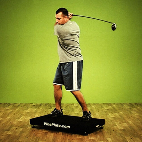 Male model trying golf swing exercises on VibePlate 2424 