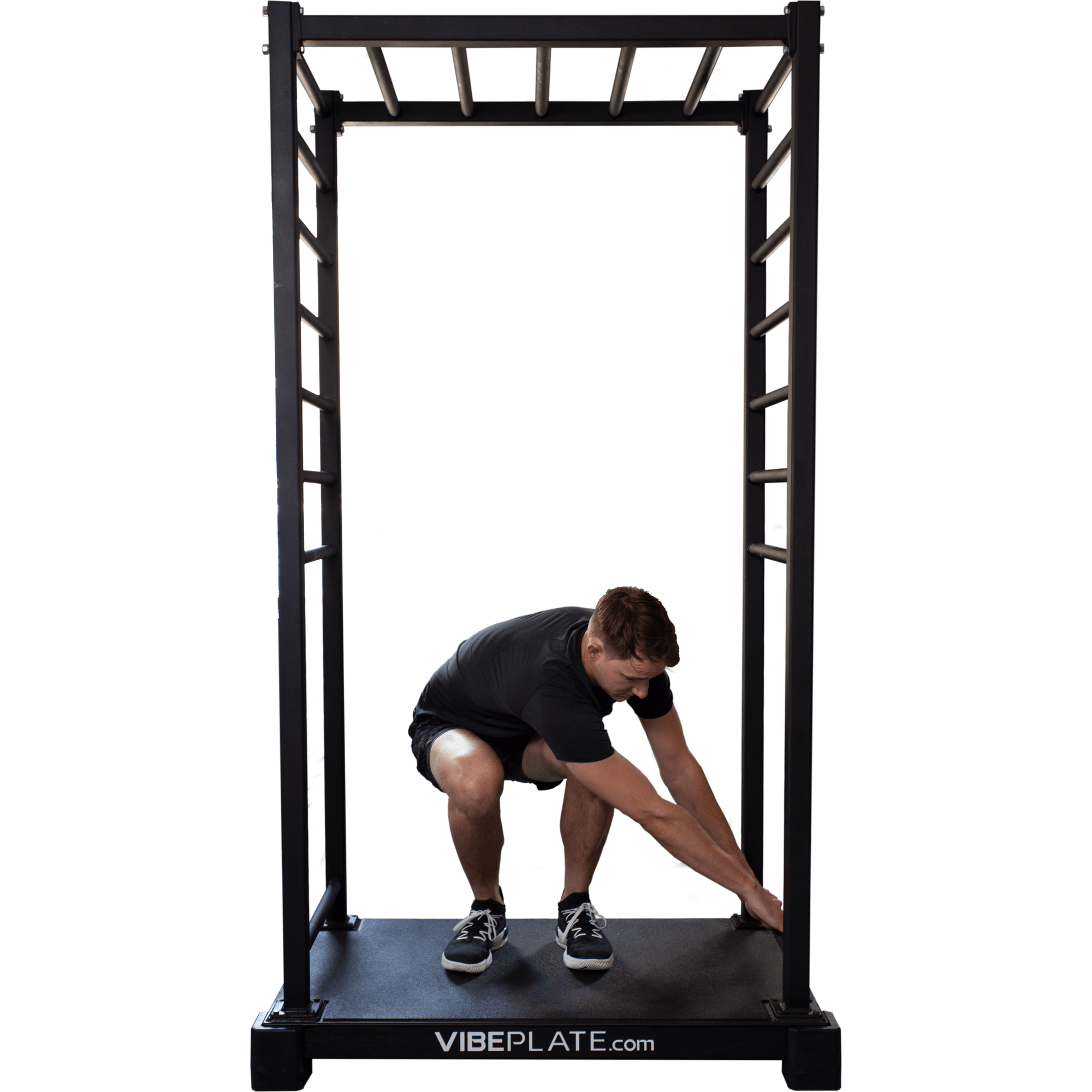 Man sitting on VibePlate VibeStretch platform, performing a lower-body stretch for increased flexibility