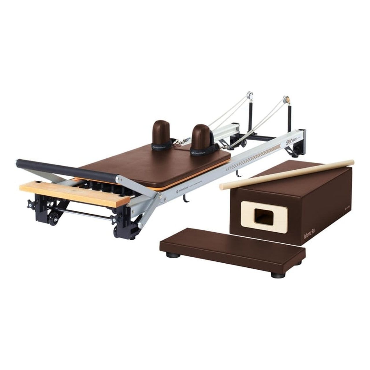 A picture of the MERRITHEW PILATES V2 MAX REFORMER in the warm and inviting Sierra Brick color, featuring a rich, deep brick red that creates a welcoming ambiance.