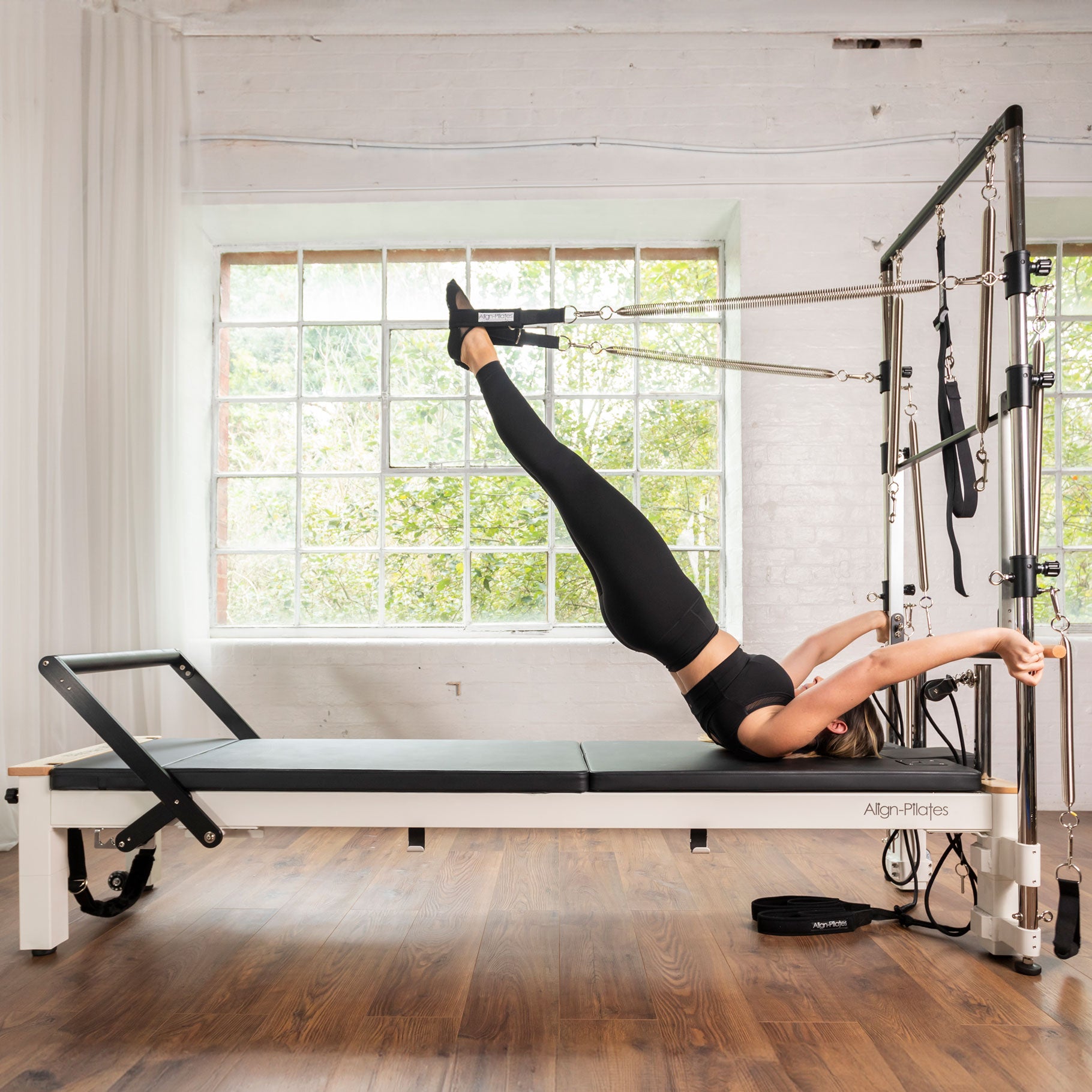 White C8-S Pro reformer with the Half Cadillac push through bar and roll down bar in place