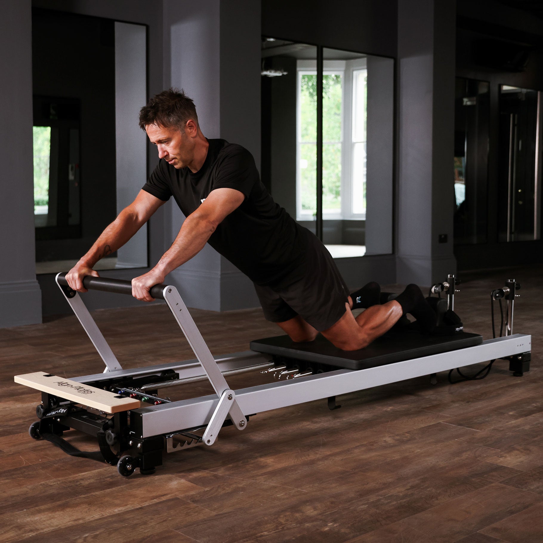 A8-Pro reformer on low legs, three quarter view showing bed height