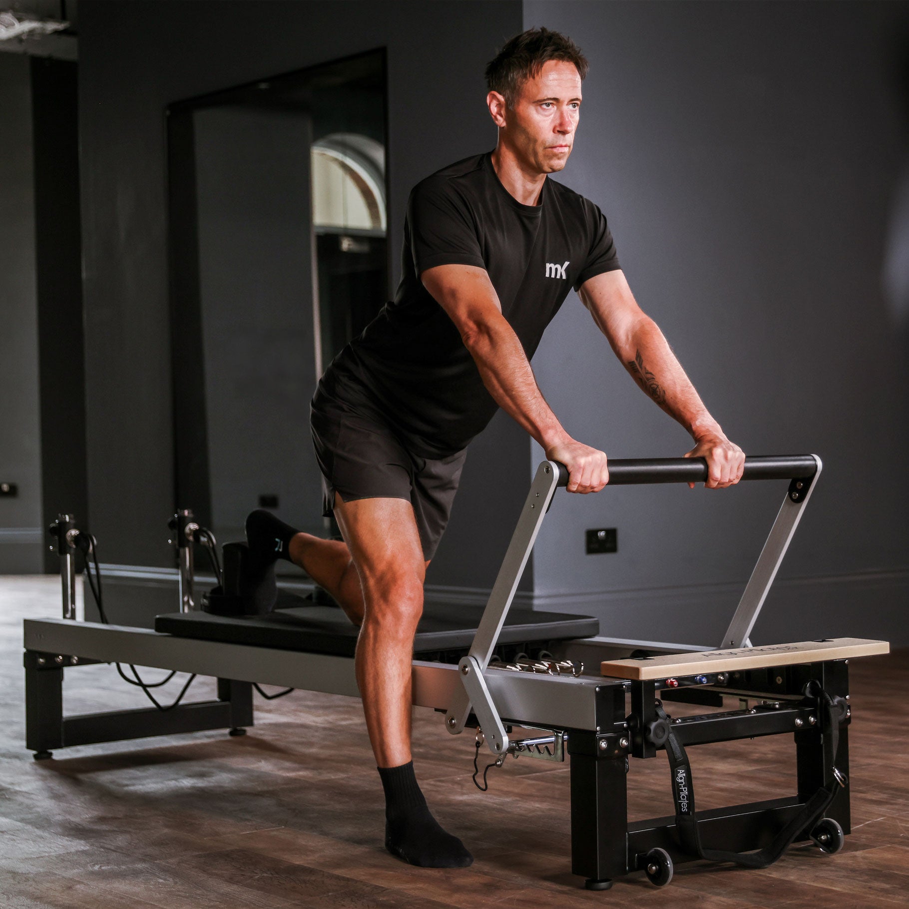 A8-Pro reformer on standard legs, three quarter view showing the rope risers