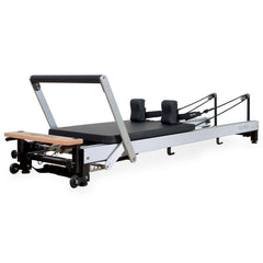 Align Pilates C8-Pro reformer, wood look finish, full side view