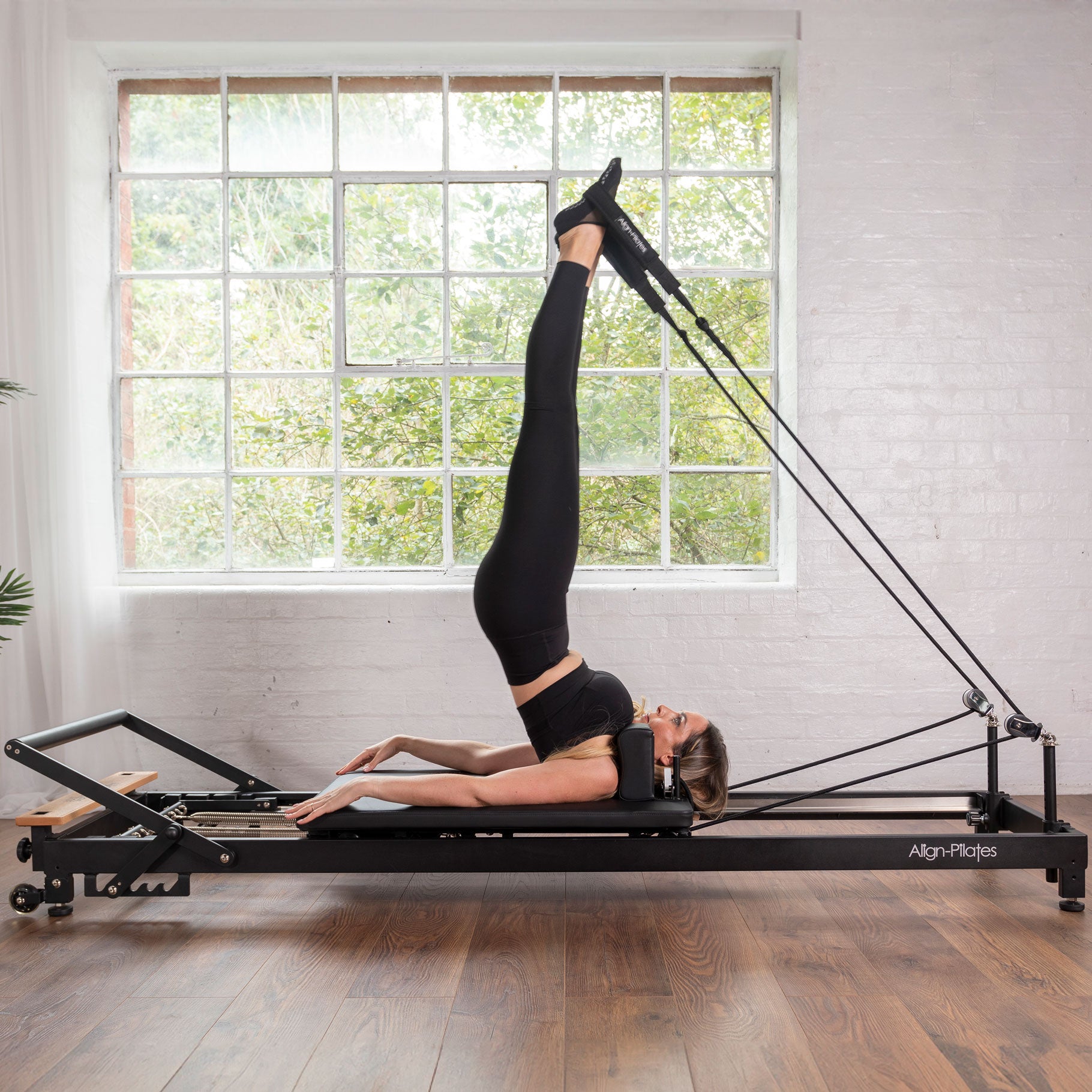 Align Pilates R8-Pro in black at an angle, carriage and footbar in view