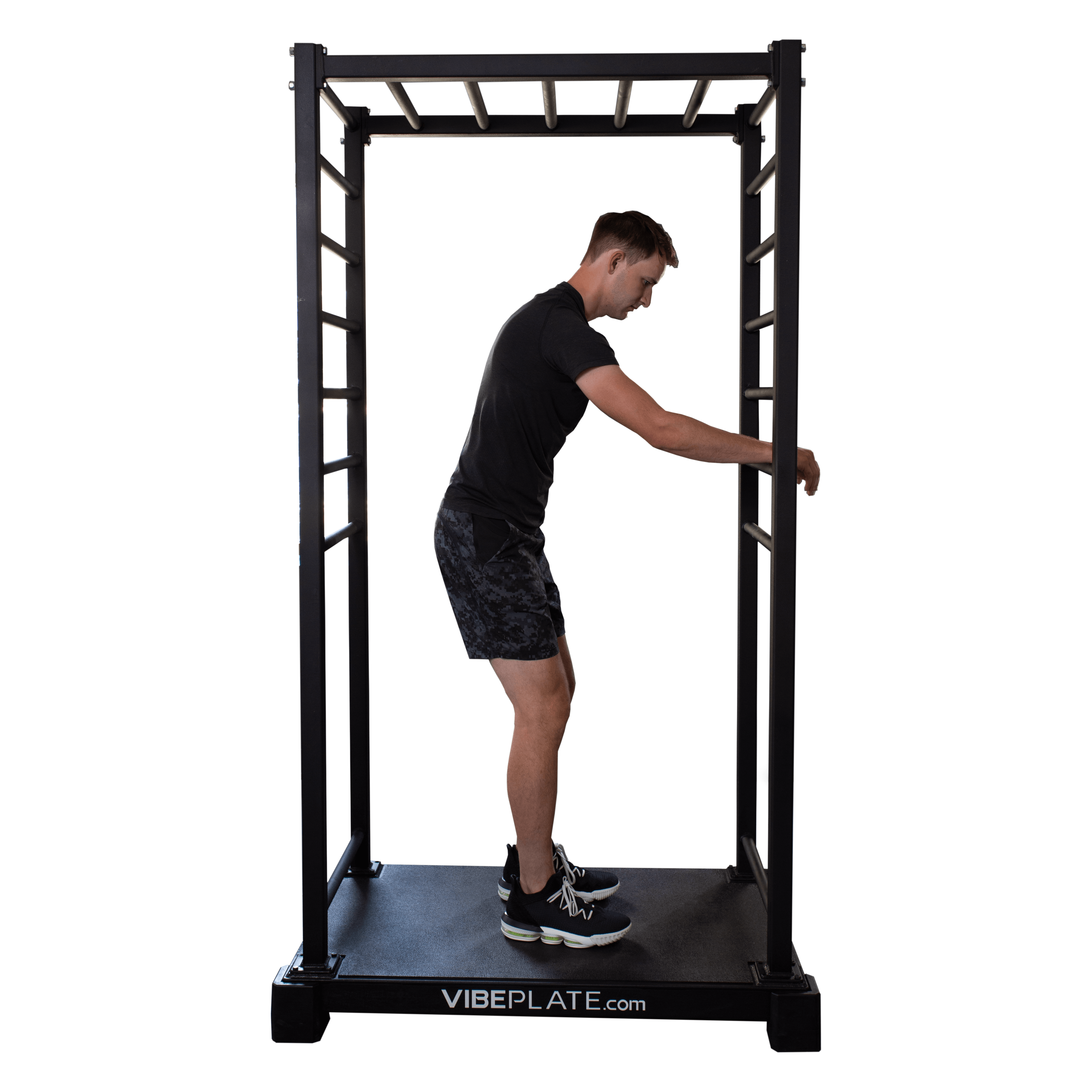 Side view of man holding VibePlate VibeStretch platform for stability, engaging in a warm-up stretch exercise