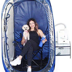 Woman and dog sitting in a home salt therapy setup with a HaloPod - RecovAthlete






