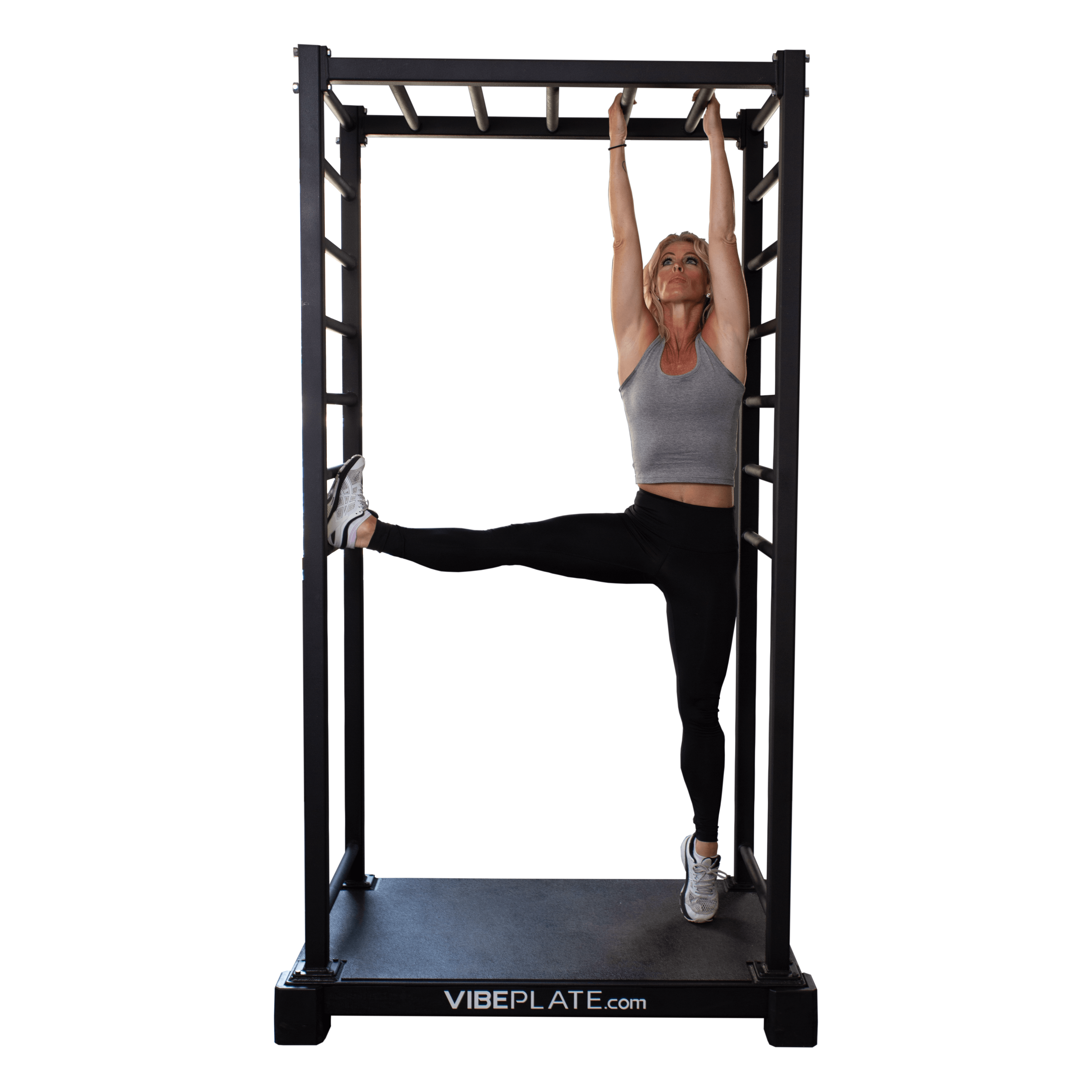 Woman stretching her leg on the VibePlate VibeStretch vibration platform, demonstrating balance and flexibility