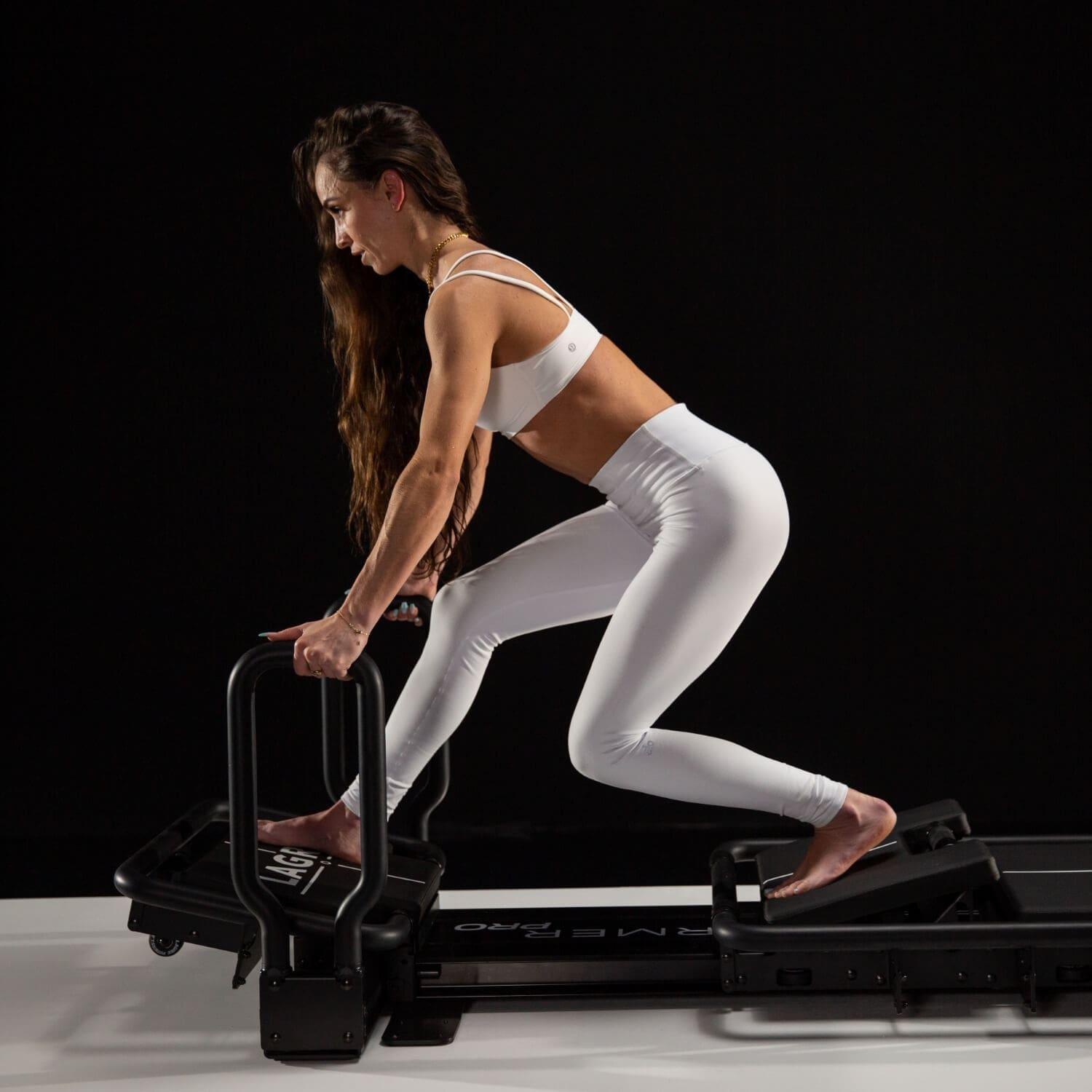fitness model displaying lagree fitness mini pro