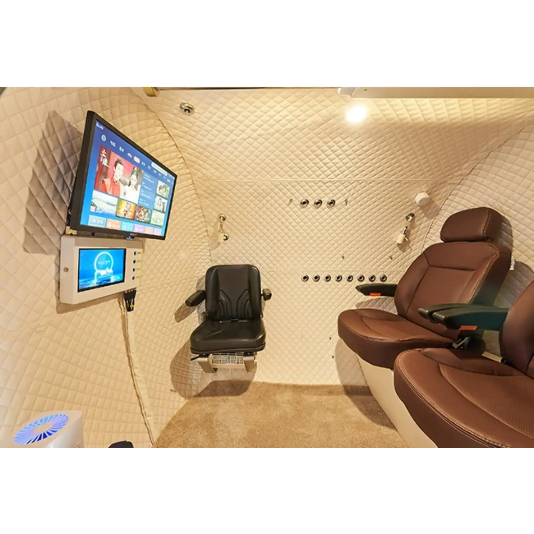 Interior of Macy-Pan Hyperbaric Oxygen Therapy Chamber HE5000 with seating and entertainment system.