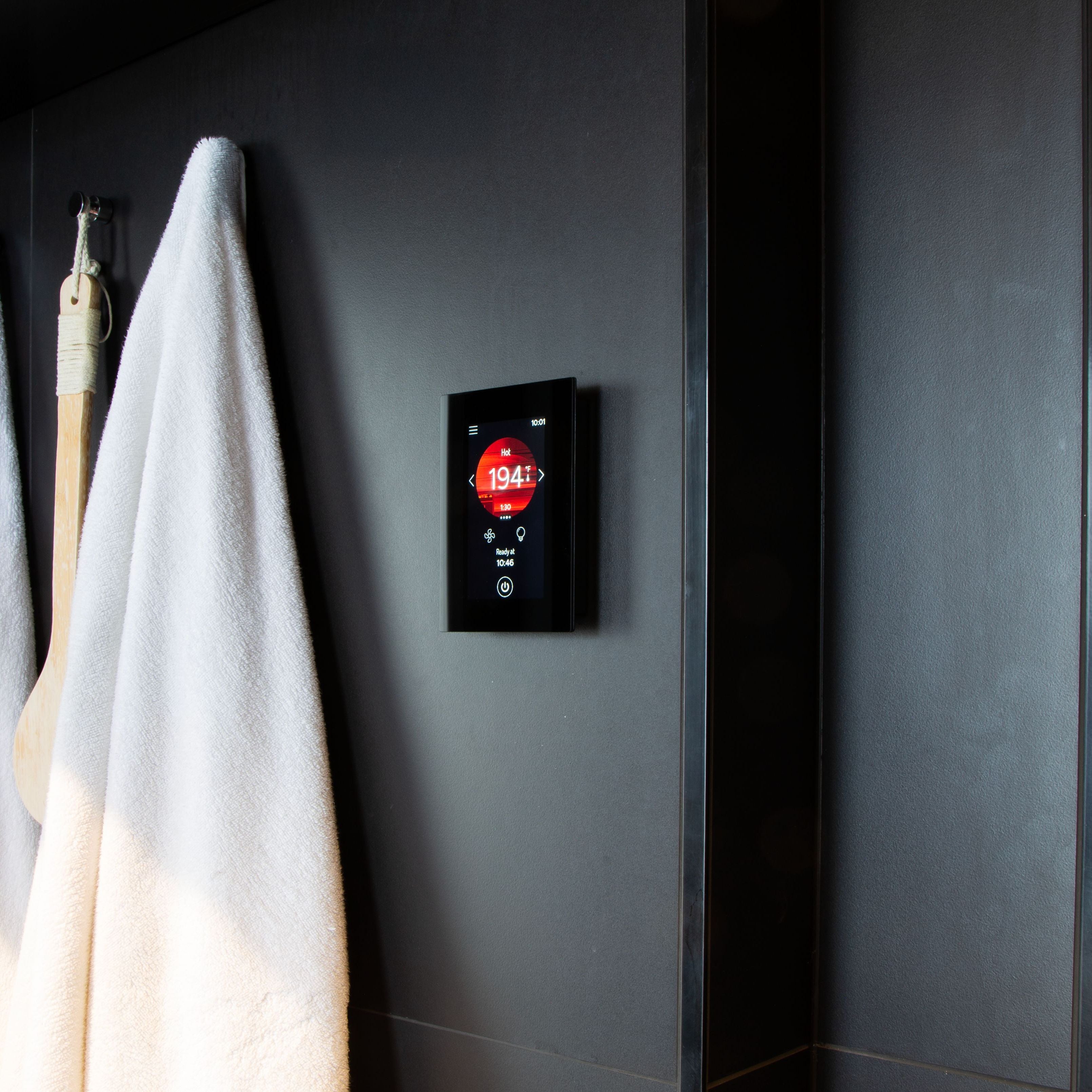 Harvia Fenix sauna control panel in a sauna changing room