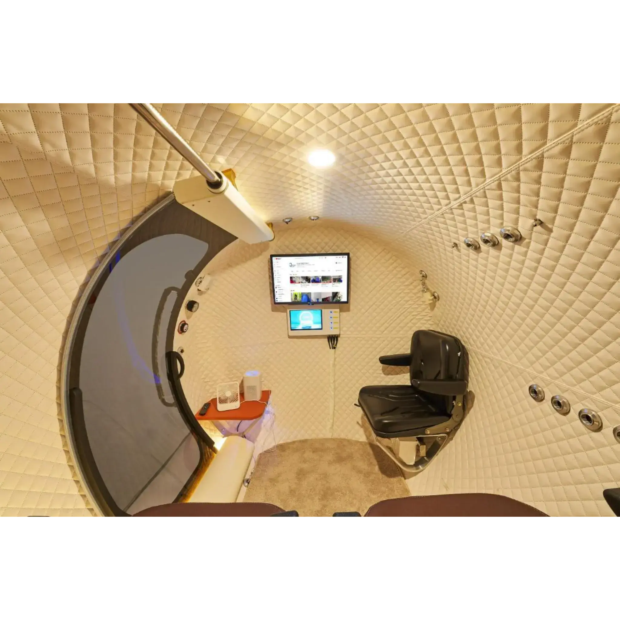 Interior view of Macy-Pan HE5000 Hyperbaric Oxygen Therapy Chamber with seating and control panel.
