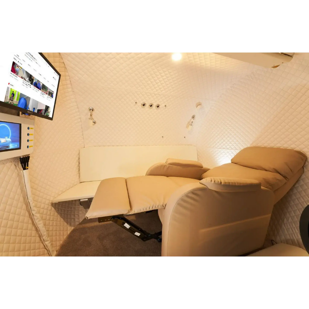 Interior view of Macy-Pan Hyperbaric Oxygen Therapy Chamber HE5000 with seating and monitoring screen.