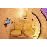 Interior of the Macy-Pan HE5000 Hyperbaric Oxygen Therapy Chamber with two reclined seats.