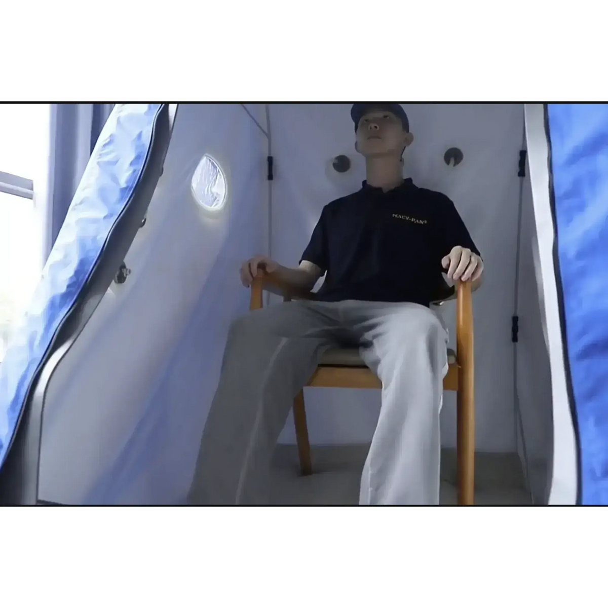 Interior view of Macy-Pan MC4000 hyperbaric chamber with mannequin seated in a chair.