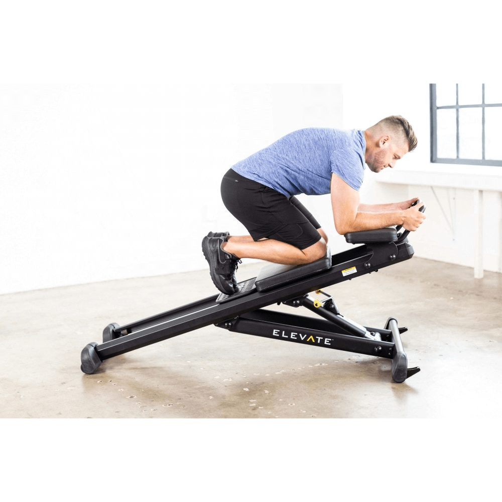 male model exercising on total gym elevate core adjustable