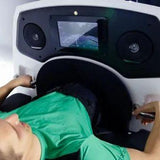 User inside Oxynova 7 chamber, view of controls and handles