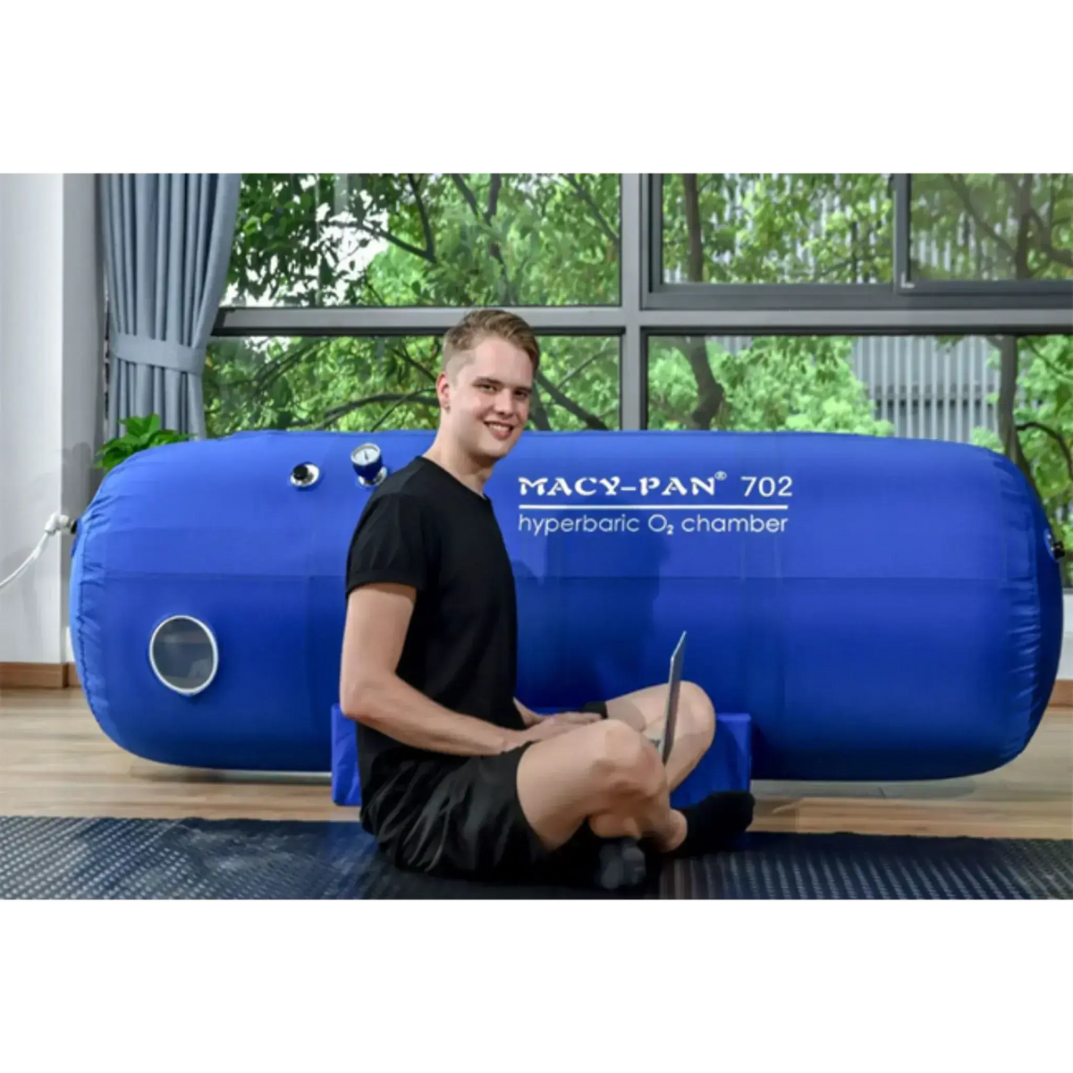 Macy-Pan Hyperbaric Oxygen Therapy Chamber ST702 with user, designed for recovery and performance optimization.