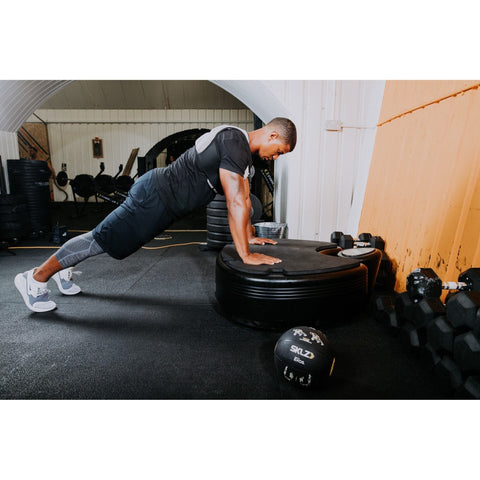 man doing pushups on Power Plate pro5HP Full Body Vibration Platform