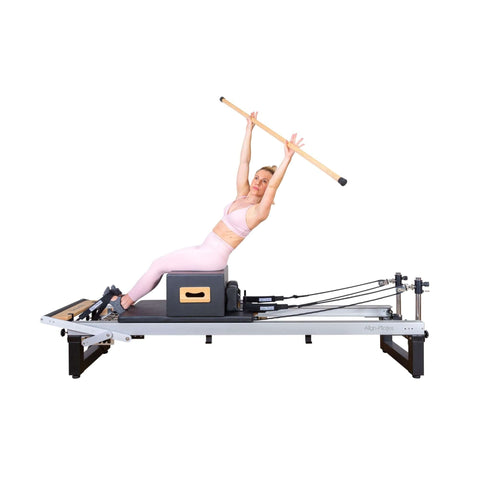 Action shot of a Pilates session using the Align A8 Reformer, displaying its smooth glide and stability.