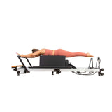 User Exercising on Align Pilates F3 Folding Home Reformer