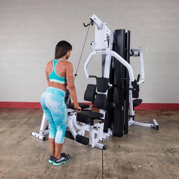 women doing bicep curl on body solid exm3000lps