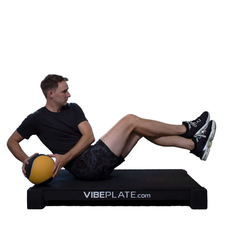 Male model strecthing  on VibePlate 3048 Whole Body Vibration Machines 