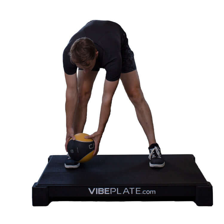 Man streching on VibePlate 3048 Whole Body Vibration Machines 