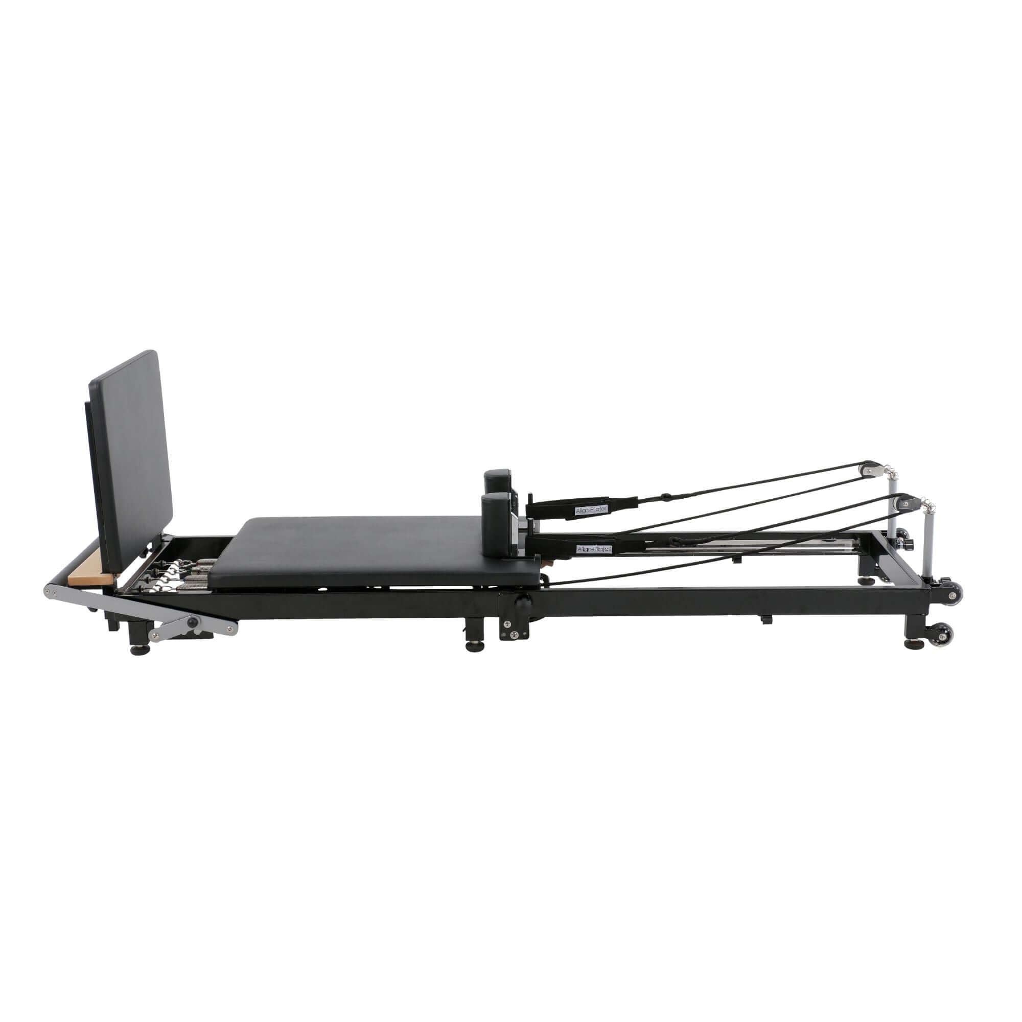 Align Pilates F2 machine with its accessories, like resistance springs and ropes, displayed for a complete workout setup.