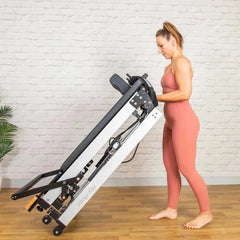 User Exercising on Align Pilates F3 Folding Home Reformer