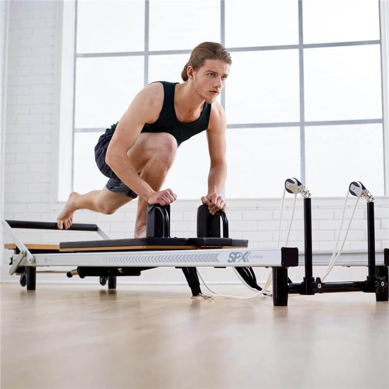 Merrithew™ At Home SPX® Reformer Package with Reformer Box, Footstrap, Padded Platform Extender and Metal Roll-up Pole – Pilates Workouts at Home