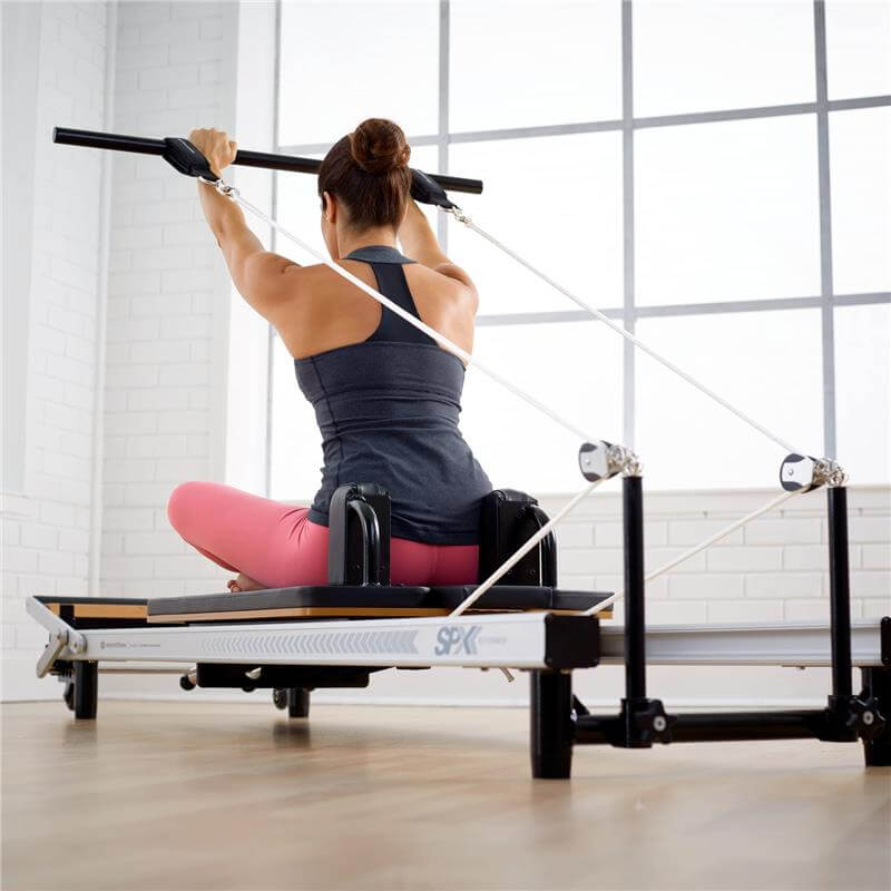 Merrithew™ At Home SPX® Reformer Package with Reformer Box, Footstrap, Padded Platform Extender and Metal Roll-up Pole – Pilates Workouts at Home