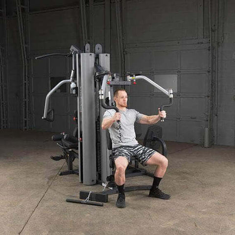man sitting on body solid g9s home gym	