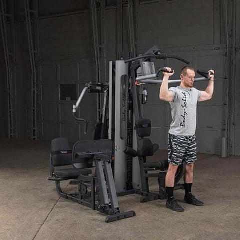 man standing and doing workout on body solid g9s home gym	