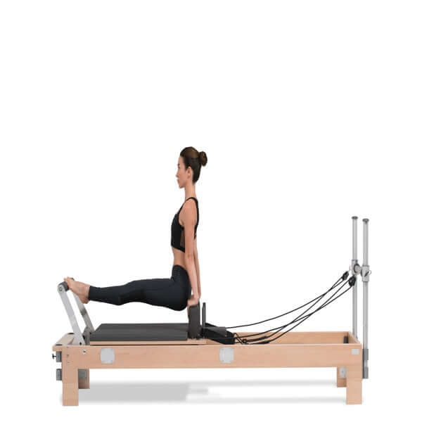 women doing leg exercises on basi systems reformer