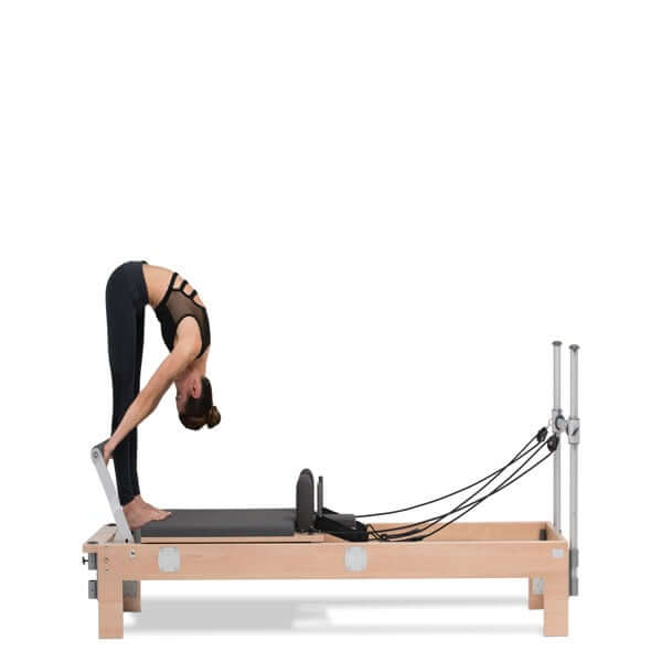 women stretching on basi pilates reformer